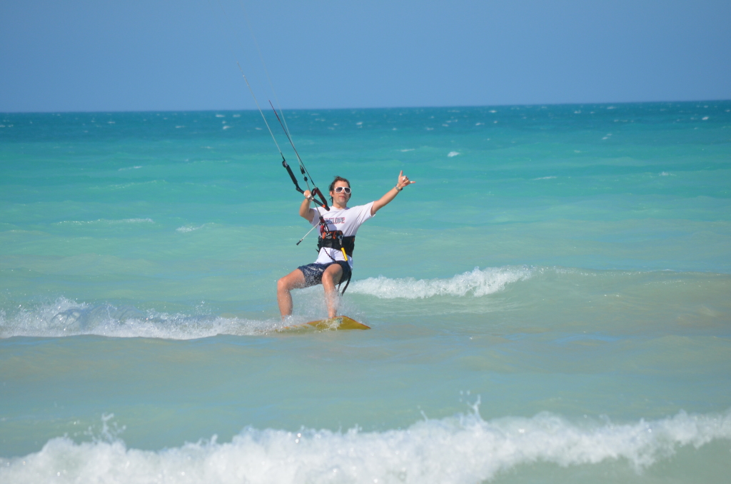 Alejandro riding his new kite: Smiles all around1